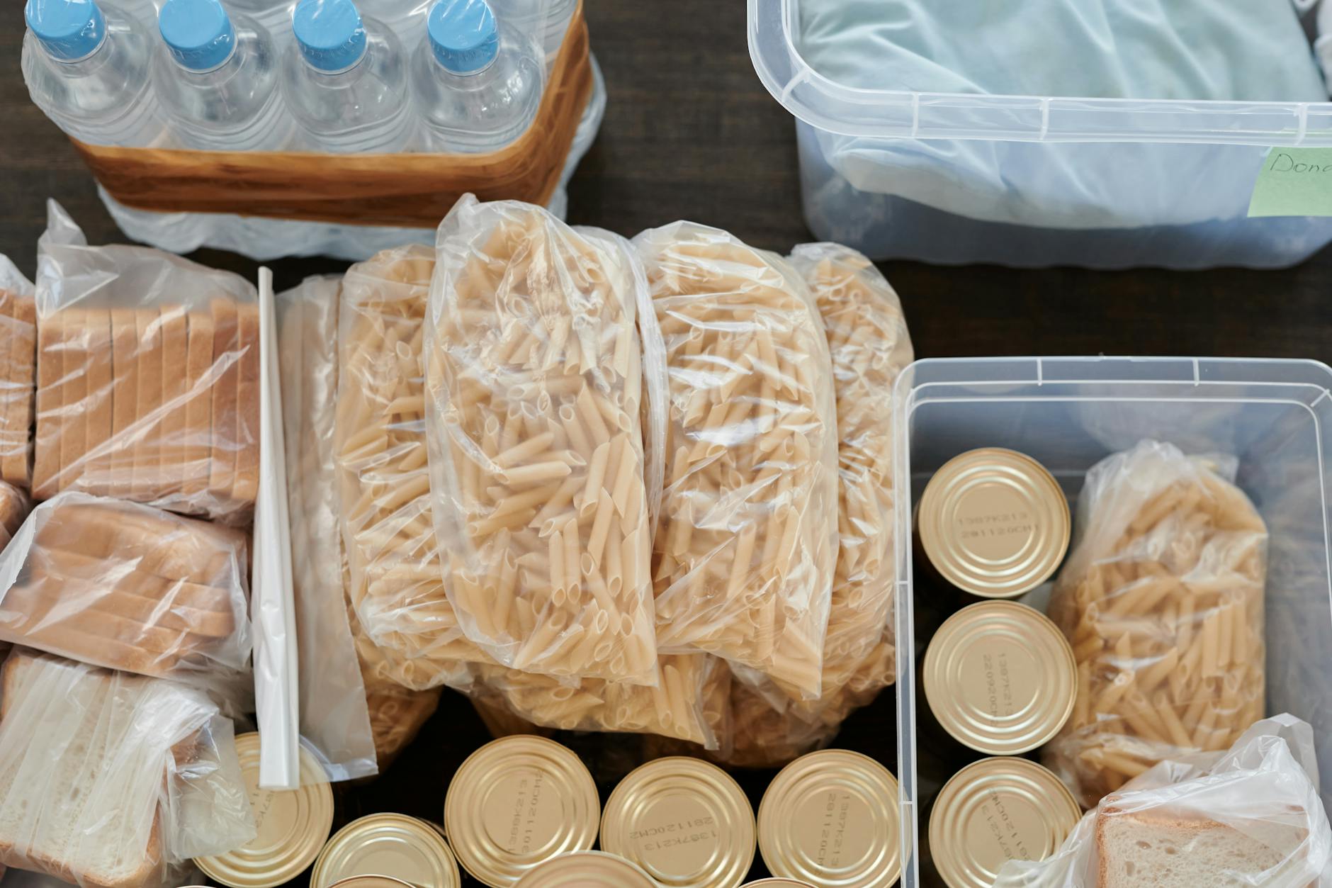 Emergency food pantry with canned goods and survival supplies improperly organized